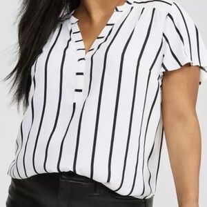 The International Concept Faria Stripe Top is a stylish blouse designed for plus